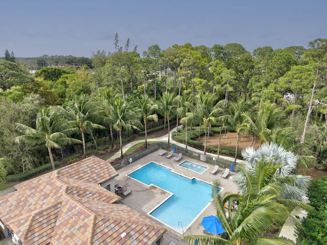 view of swimming pool featuring a patio area and a hot tub