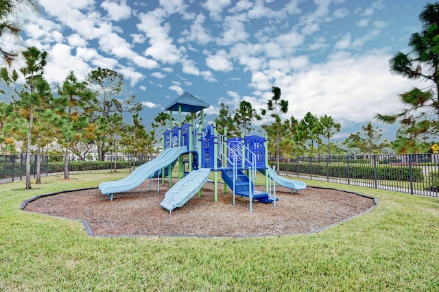 view of jungle gym featuring a lawn