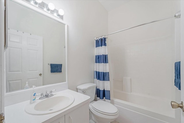 full bathroom featuring shower / tub combo with curtain, toilet, and vanity