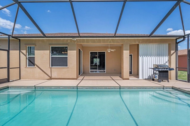 view of swimming pool featuring a patio, ceiling fan, a grill, and a lanai