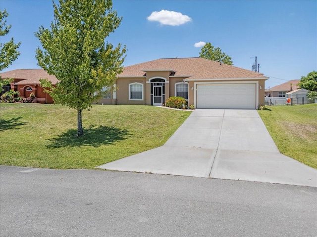 view of front facade with a front yard and a garage