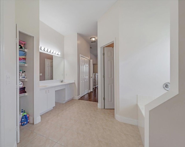 bathroom with tile patterned floors and vanity