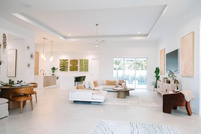 living room featuring a raised ceiling