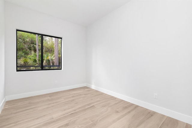 spare room featuring light hardwood / wood-style flooring