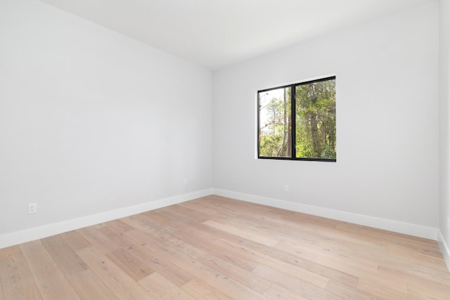 unfurnished room with light hardwood / wood-style flooring