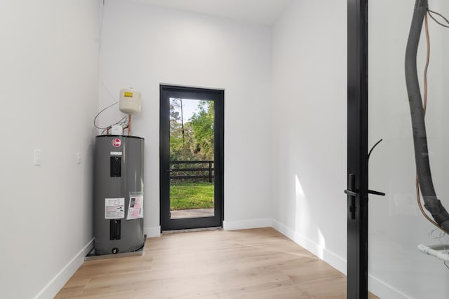 entryway featuring light hardwood / wood-style floors and water heater