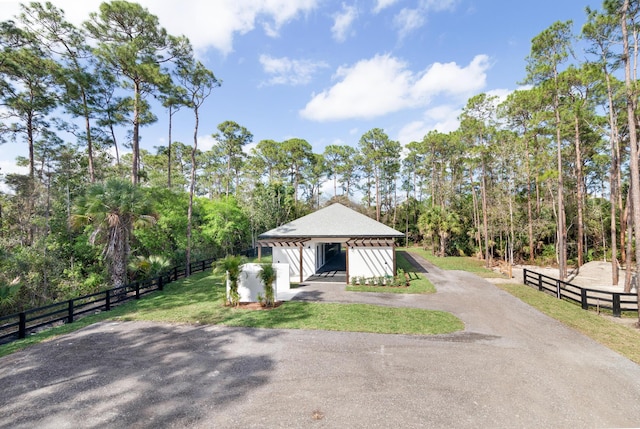 view of front of house with a front yard and a garage