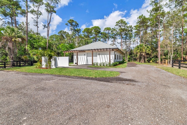 view of front of house with a front yard and a garage