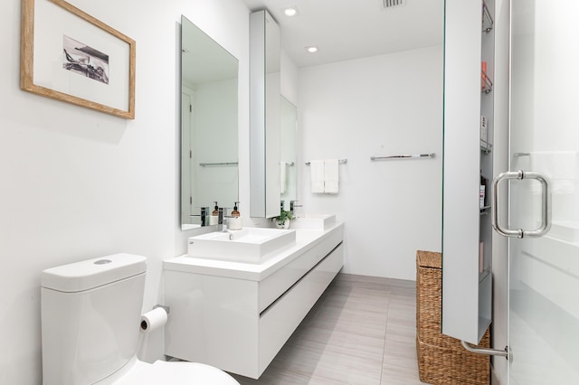 bathroom featuring toilet and vanity