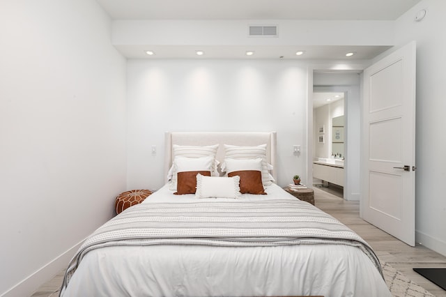 bedroom with light wood-type flooring