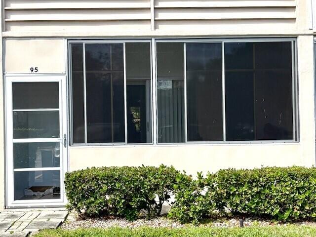 view of side of property with stucco siding