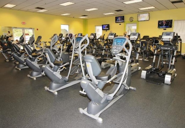 exercise room with a paneled ceiling