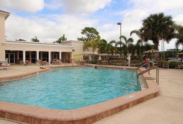 community pool with a patio