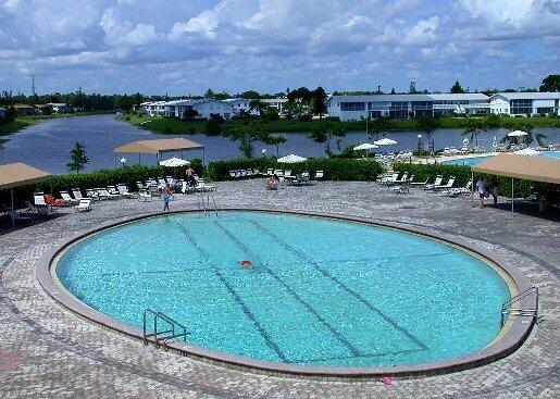 community pool with a patio area