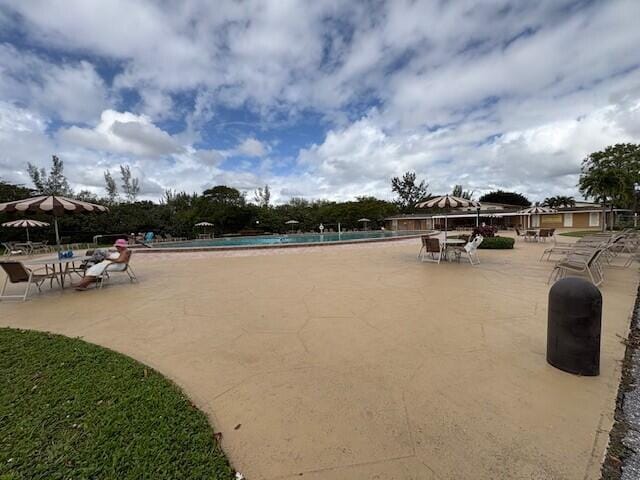 community pool featuring a patio area