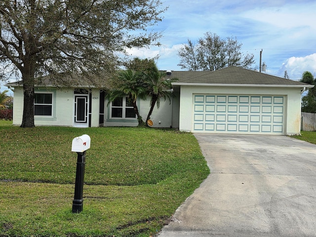 ranch-style home featuring a front lawn and a garage