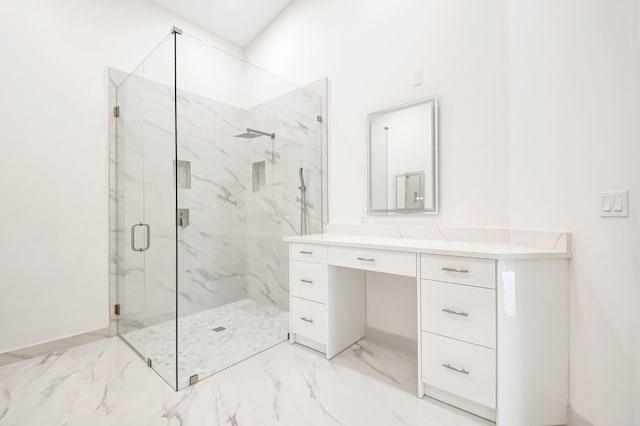 bathroom with vanity and a shower with door