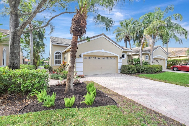 view of front of property with a garage