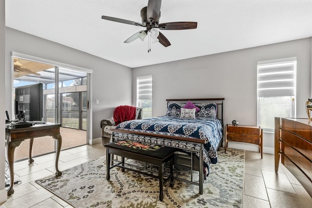 bedroom featuring access to exterior, baseboards, and a ceiling fan