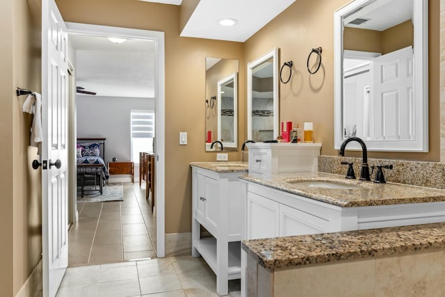 full bathroom featuring tile patterned floors, baseboards, visible vents, and vanity