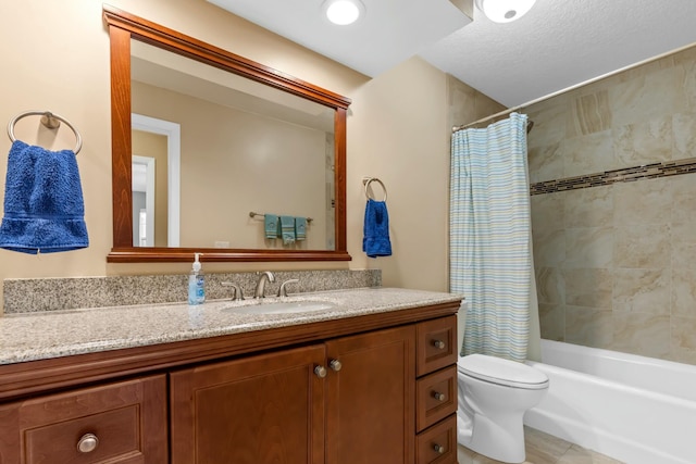 bathroom featuring shower / bath combo, vanity, and toilet