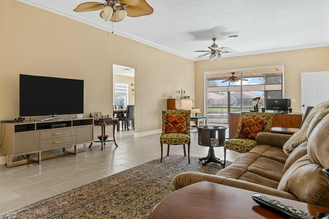 living room featuring a ceiling fan, baseboards, crown molding, and tile patterned floors