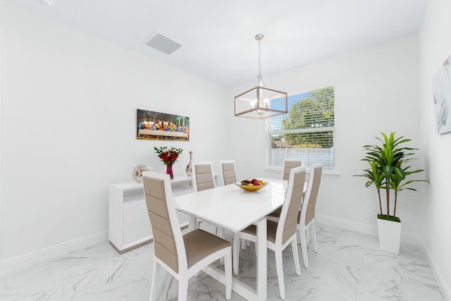 dining area featuring a chandelier