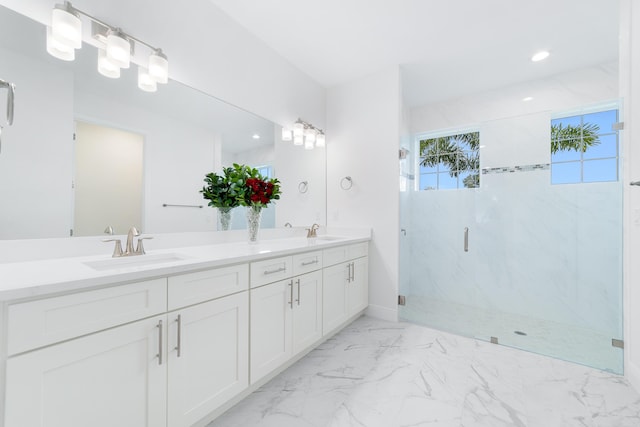 bathroom featuring vanity and a shower with shower door