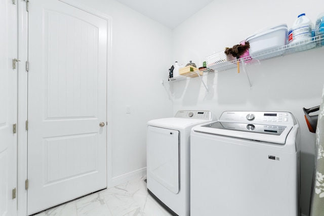 laundry area with separate washer and dryer