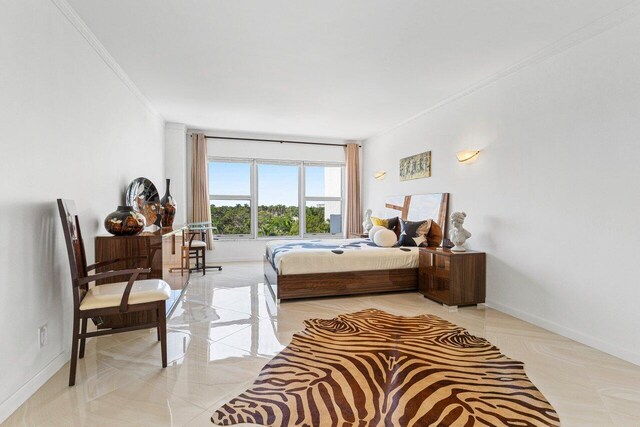 875 E Camino Real Unit 7E, Boca Raton, FL 33432 - bedroom featuring crown molding