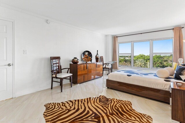 875 E Camino Real Unit 7E, Boca Raton, FL 33432 - bedroom featuring ornamental molding