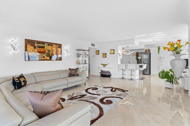 875 E Camino Real Unit 7E, Boca Raton, FL 33432 - living room with crown molding