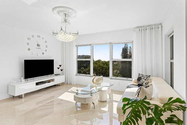 875 E Camino Real Unit 7E, Boca Raton, FL 33432 - living room with a chandelier and crown molding