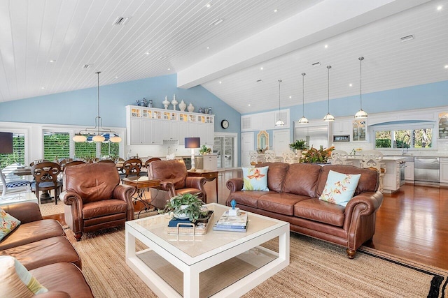 living area with visible vents, high vaulted ceiling, a notable chandelier, light wood-style floors, and wood ceiling