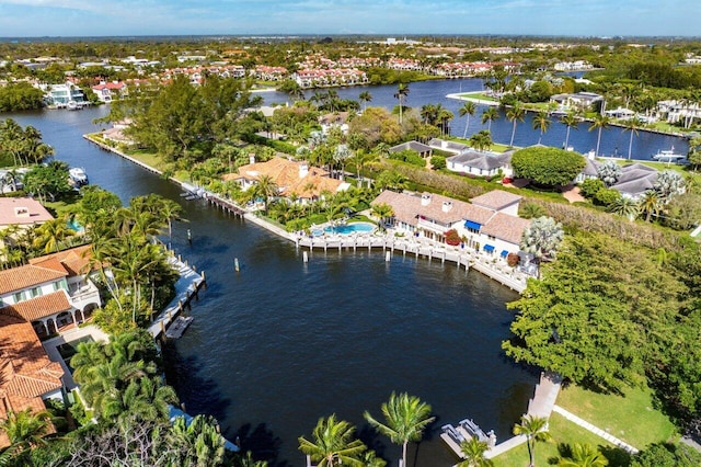 bird's eye view featuring a water view and a residential view