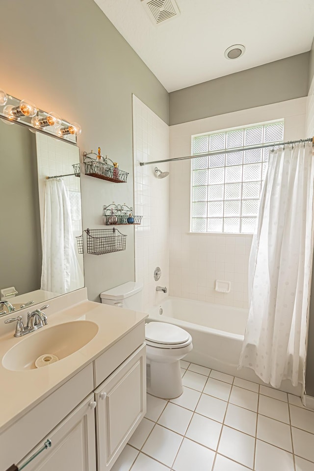 bathroom with a wealth of natural light, shower / tub combo, tile patterned flooring, and visible vents