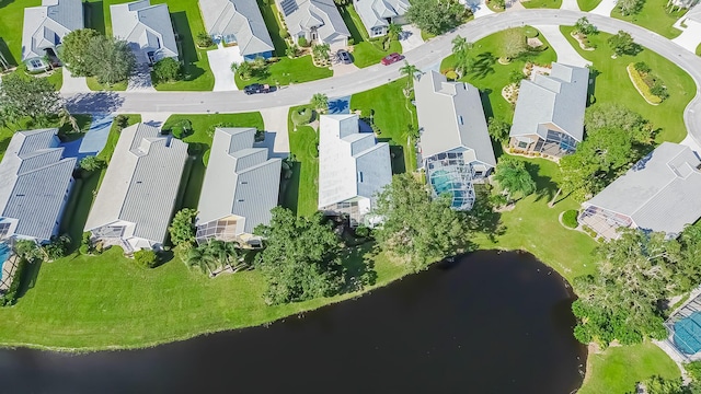 aerial view featuring a water view and a residential view