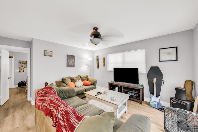 431 SW 1st Ave, Boynton Beach, FL 33435 - living room featuring ceiling fan and light hardwood / wood-style flooring