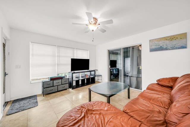 431 SW 1st Ave, Boynton Beach, FL 33435 - living room with light tile patterned flooring and ceiling fan