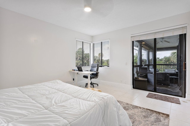 bedroom with access to exterior, baseboards, and tile patterned floors