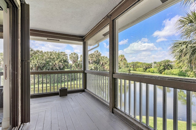 wooden deck featuring a water view