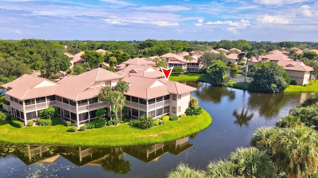 aerial view with a residential view and a water view