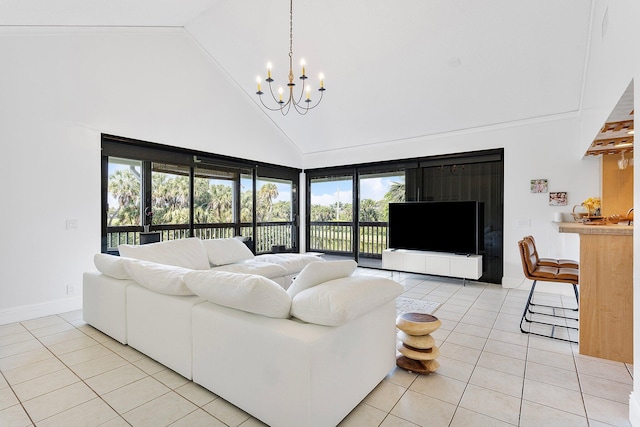 living room with high vaulted ceiling, a chandelier, baseboards, and light tile patterned floors