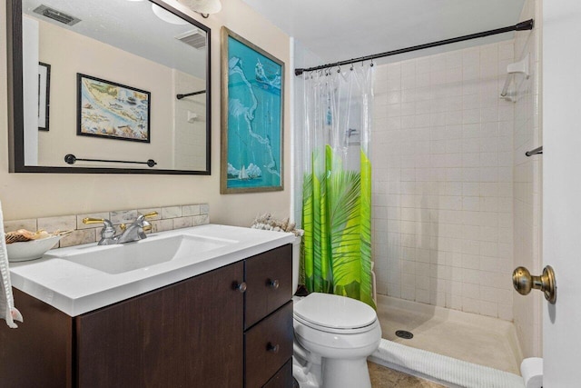 bathroom featuring toilet, a shower with curtain, and vanity