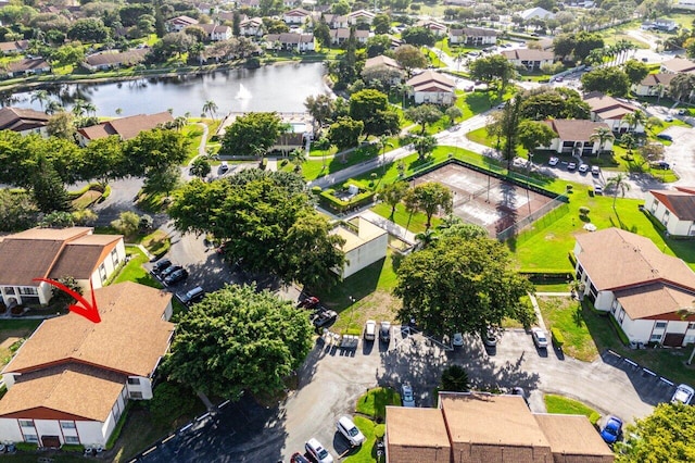 birds eye view of property featuring a water view