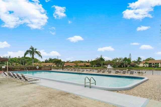 view of swimming pool with a patio area