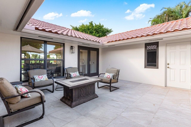 view of patio with an outdoor fire pit