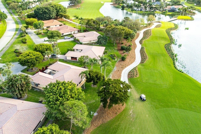 aerial view with a water view, a residential view, and golf course view