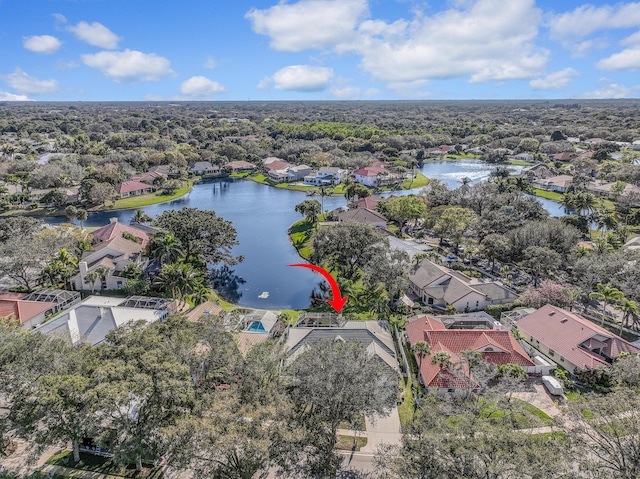 drone / aerial view with a residential view and a water view