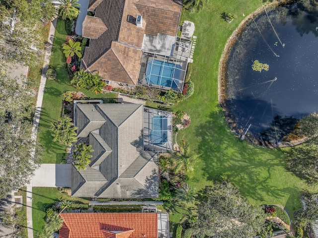 birds eye view of property with a water view